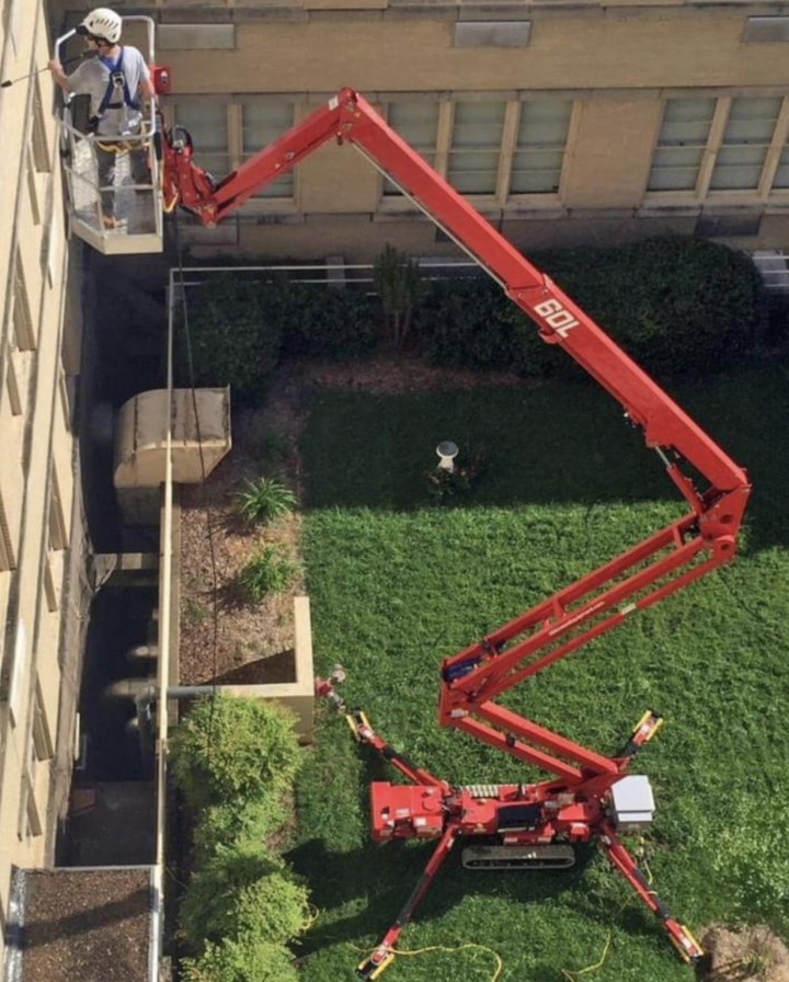 Benjamin's team washing a building